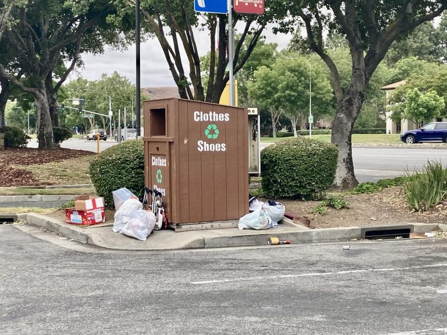 Overflow and dumping at a competitor bin.
