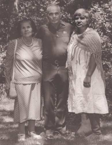 Rosemary Cambra standing outdoors with her uncle Robert Sanchez and her mother Dolores Sanchez