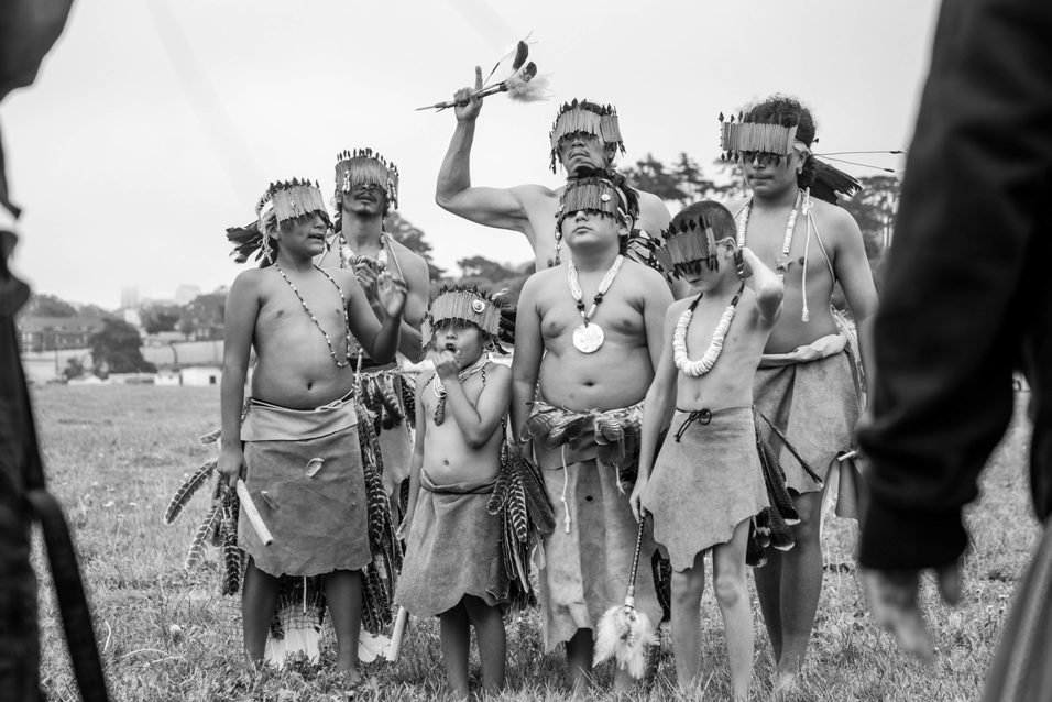 Muwekma Ohlone dancers in traditional regalia, black and white