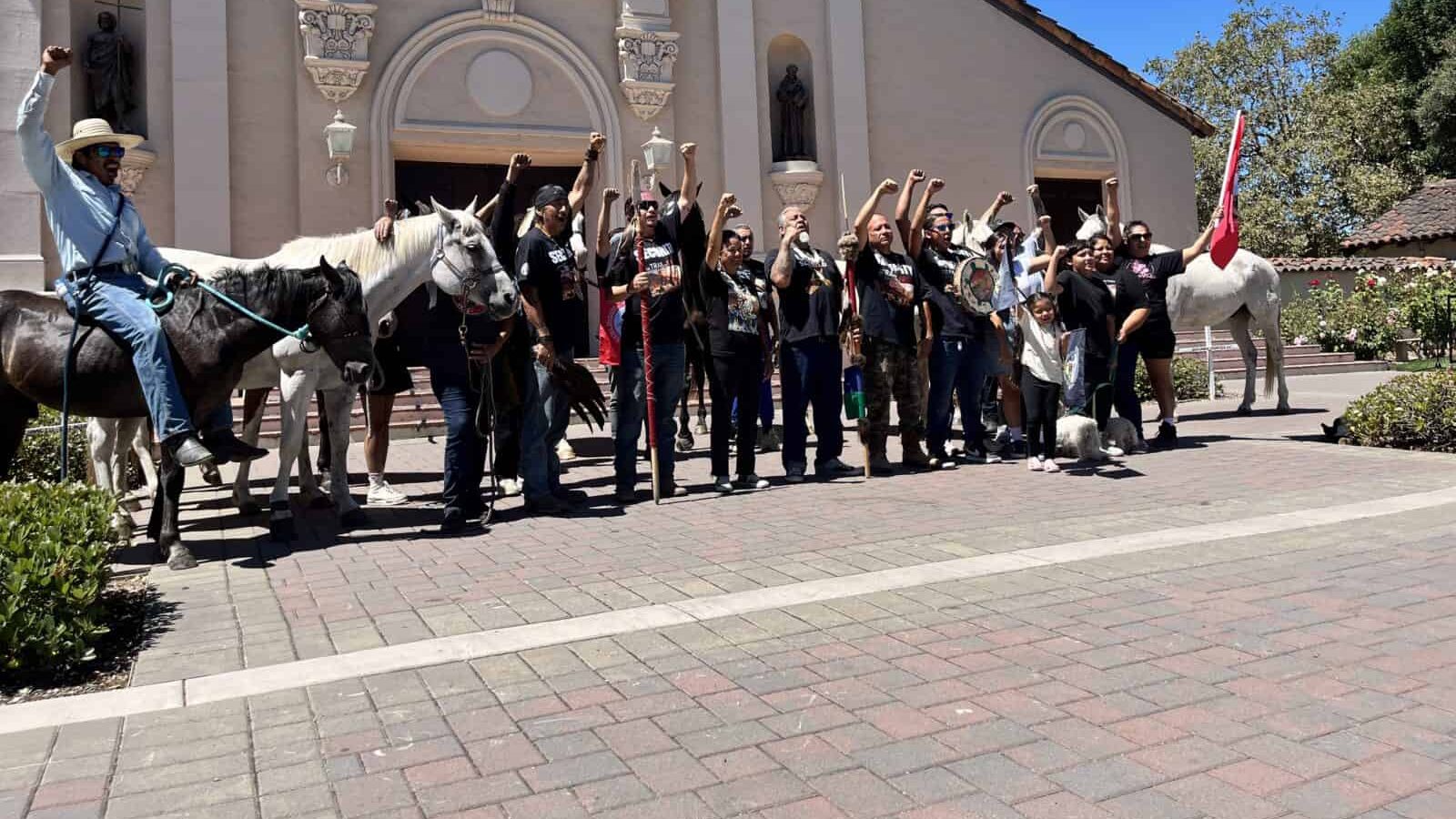Muwekma Ohlone Tribal members, some on horseback, gathered outside Mission Santa Clara